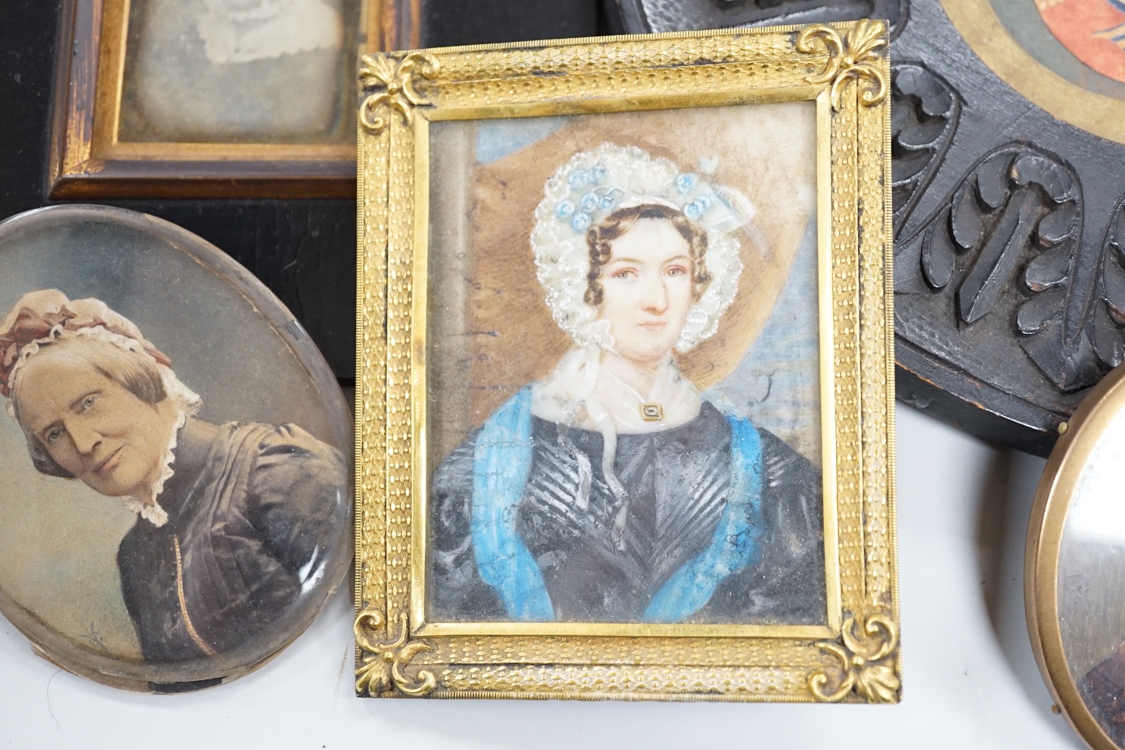 Continental School, 18th century, portrait miniature on ivory, Portrait of a Lady in a red dress, together with six other portraits. To include the subject of military interest: a portrait watercolour of General Isaac Br